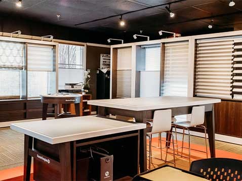 Store interior showcasing several different types of window coverings
